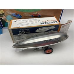 Schylling - six tinplate models comprising Sir Ian’s Bluebird racing car, Speedway Auto Racer, two Aluminium Airships, Tin Speedboat and Ernest in the Music Box; all in original boxes 