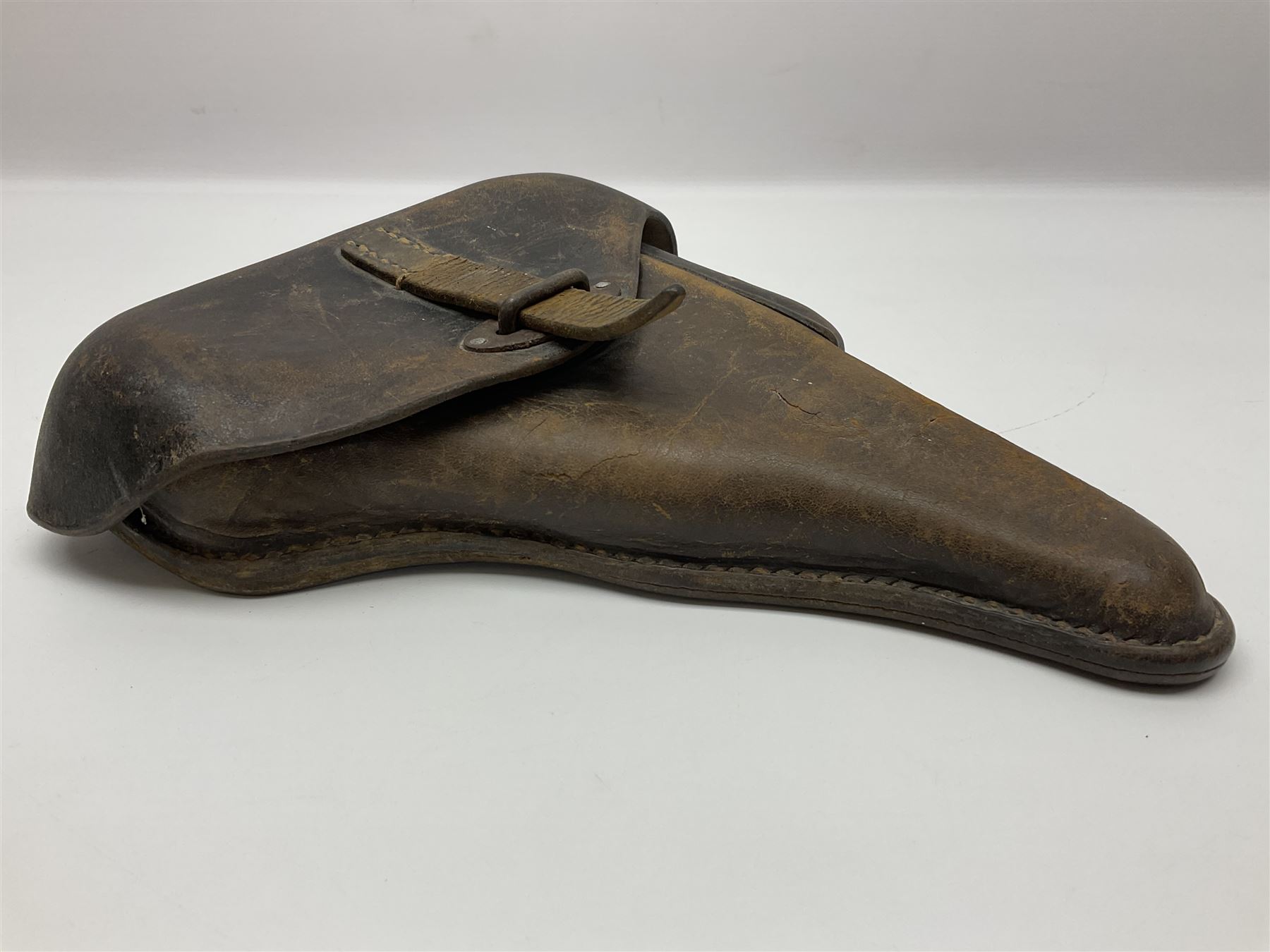 WWII German brown leather holster with side magazine pouch for a Walther P.38 semi-automatic pistol, stamped P38 and OWX 1941 on back L24.5cm