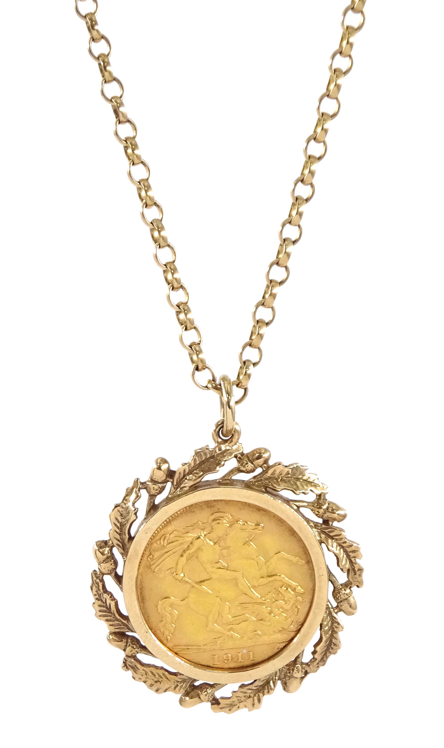 King George V 1911 gold half sovereign coin, loose mounted in acorn and oak leaf mount, on gold chain link necklace, both 9ct