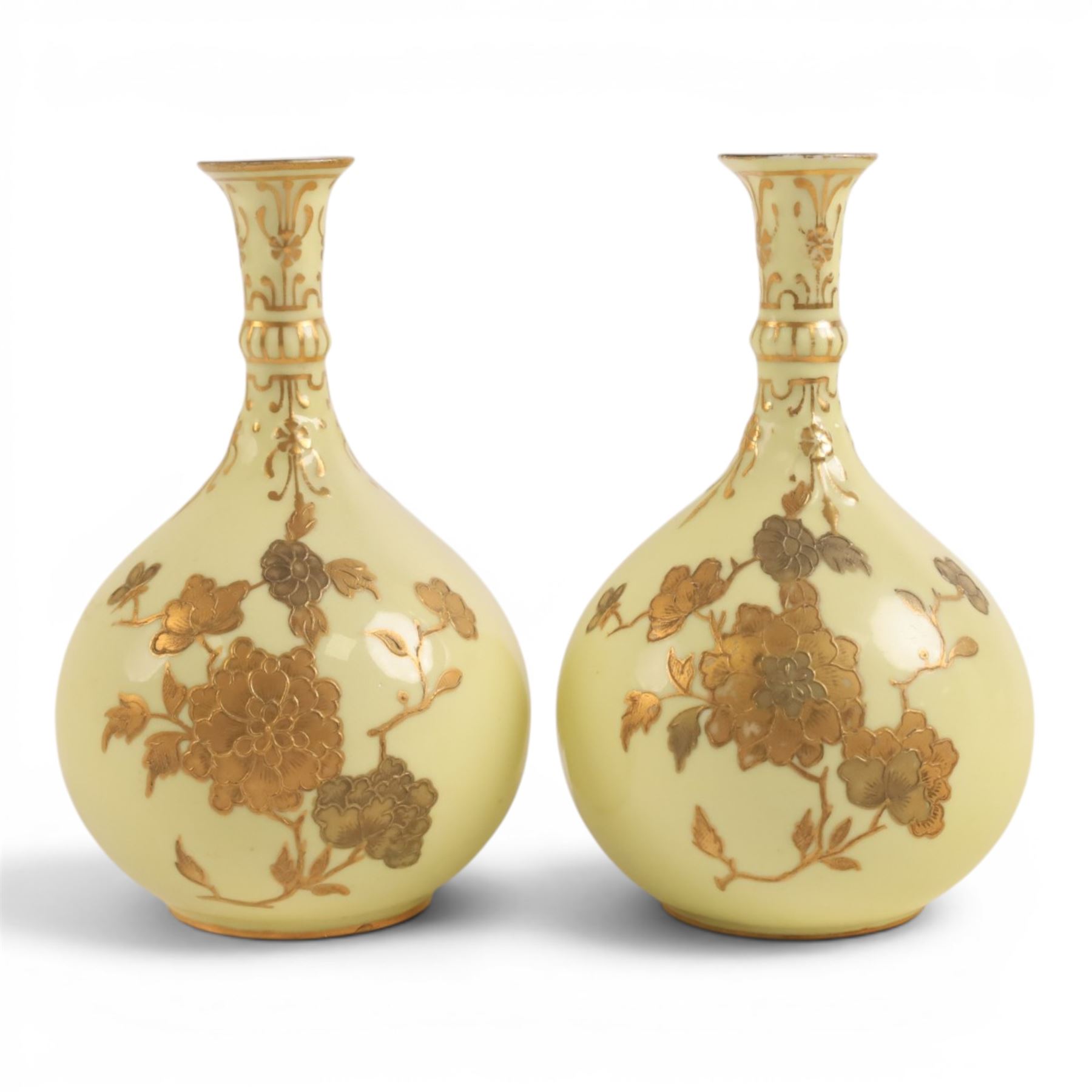 Pair of Royal Crown Derby bud vases, decorated with gilt floral sprigs upon a yellow ground, marked beneath, H14cm