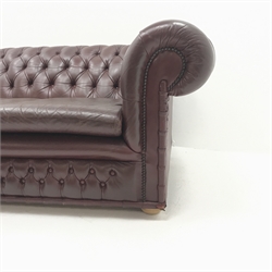 Three seat chesterfield sofa upholstered in a deep buttoned maroon leather, W205cm