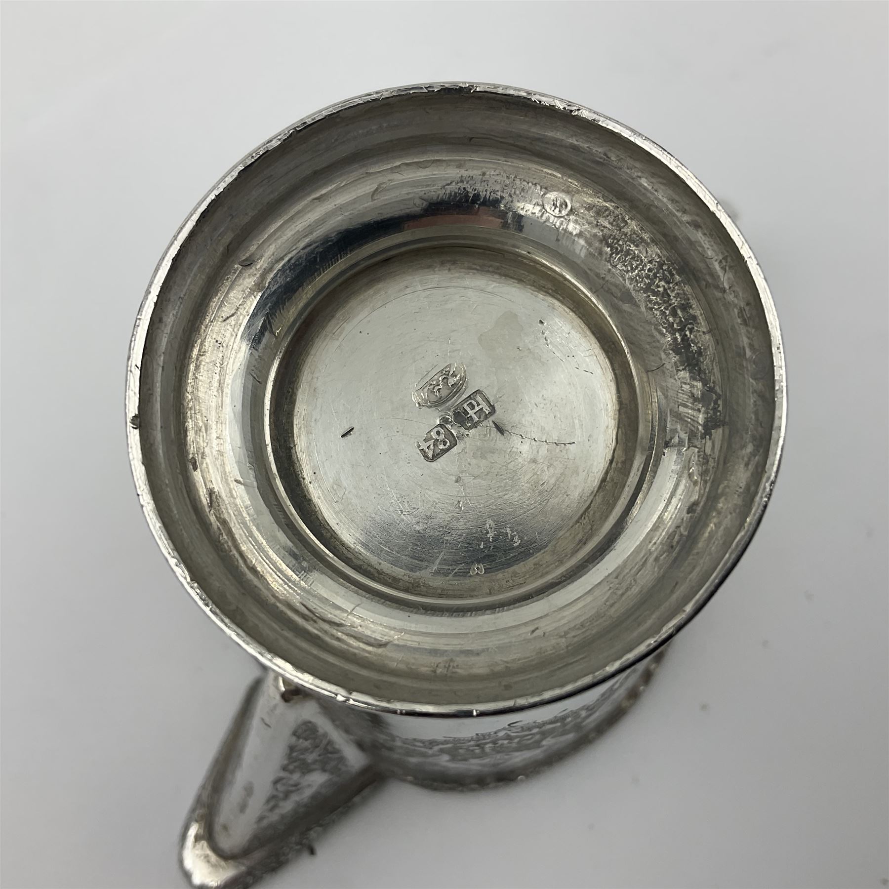 Early/mid 20th century Persian silver tea service, comprising circular serving tray, teapot, twin handled sucrier and cover, milk jug, five tea glasses with six silver holders, six tea spoons, and pair of sugar tongs, each profusely chased with foliate arabesque decoration, each bearing marks including 84 for 840 fineness, tray D40cm, teapot H16cm