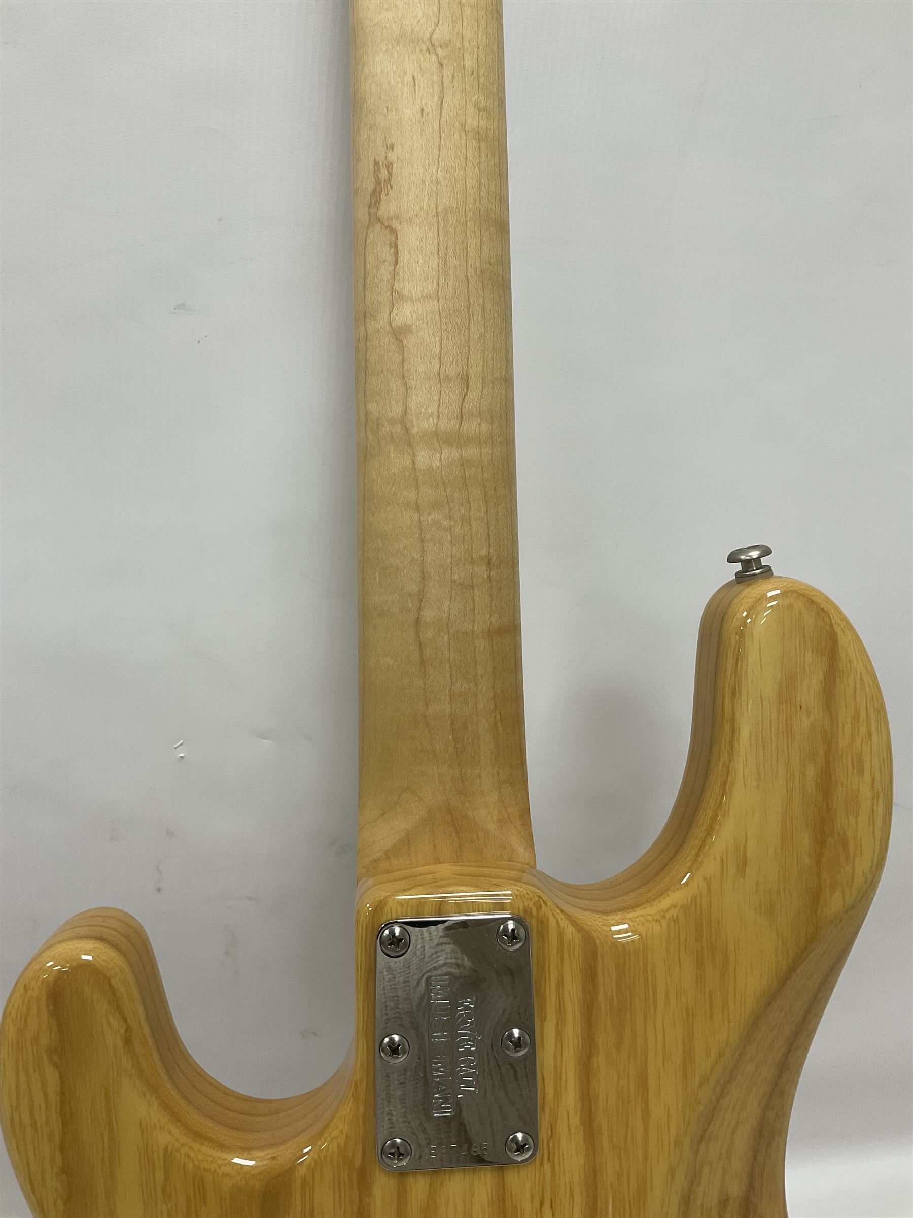 Ernie Ball Music Man Sting Ray 4 string bass guitar, in natural finish with roasted maple neck and tortoiseshell effect scratch guard, serial no 87485, in black Music Man hard case, guitar L114cm