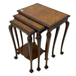Mid 20th century figured nest of three tables, rectangular tops with foliate carved edge, acanthus carved cabriole supports with ball and claw feet, the smallest table with shaped undertier