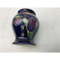 Mid 20th century Moorcroft vase of baluster form decorated in the Orchid pattern on blue ground, shape no. 146, with impressed Moorcroft, Made in England marks beneath, H8cm