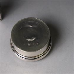 Two early 20th century silver pill/patch boxes, together with two glass perfume bottles with silver overlay and stoppers, all stamped or hallmarked, smallest box D2cm, largest bottle H7cm