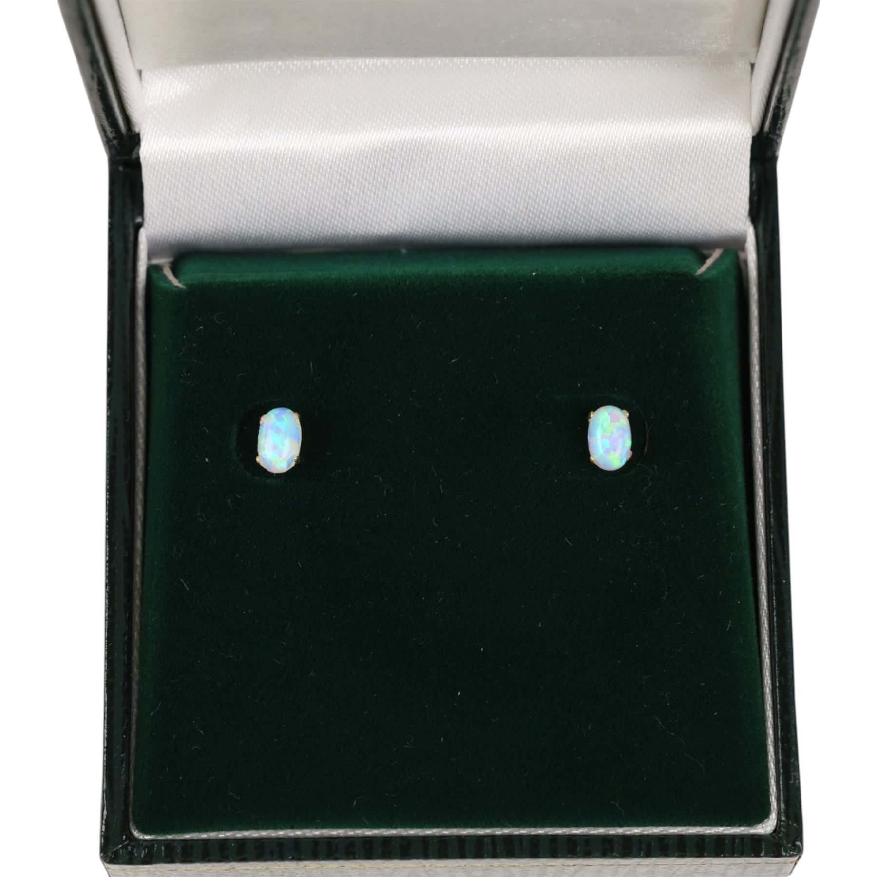 Pair of 9ct gold opal earrings, boxed