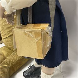 Mid-20th century woodwool filled teddy bear; and porcelain doll dressed as a WW2 evacuee