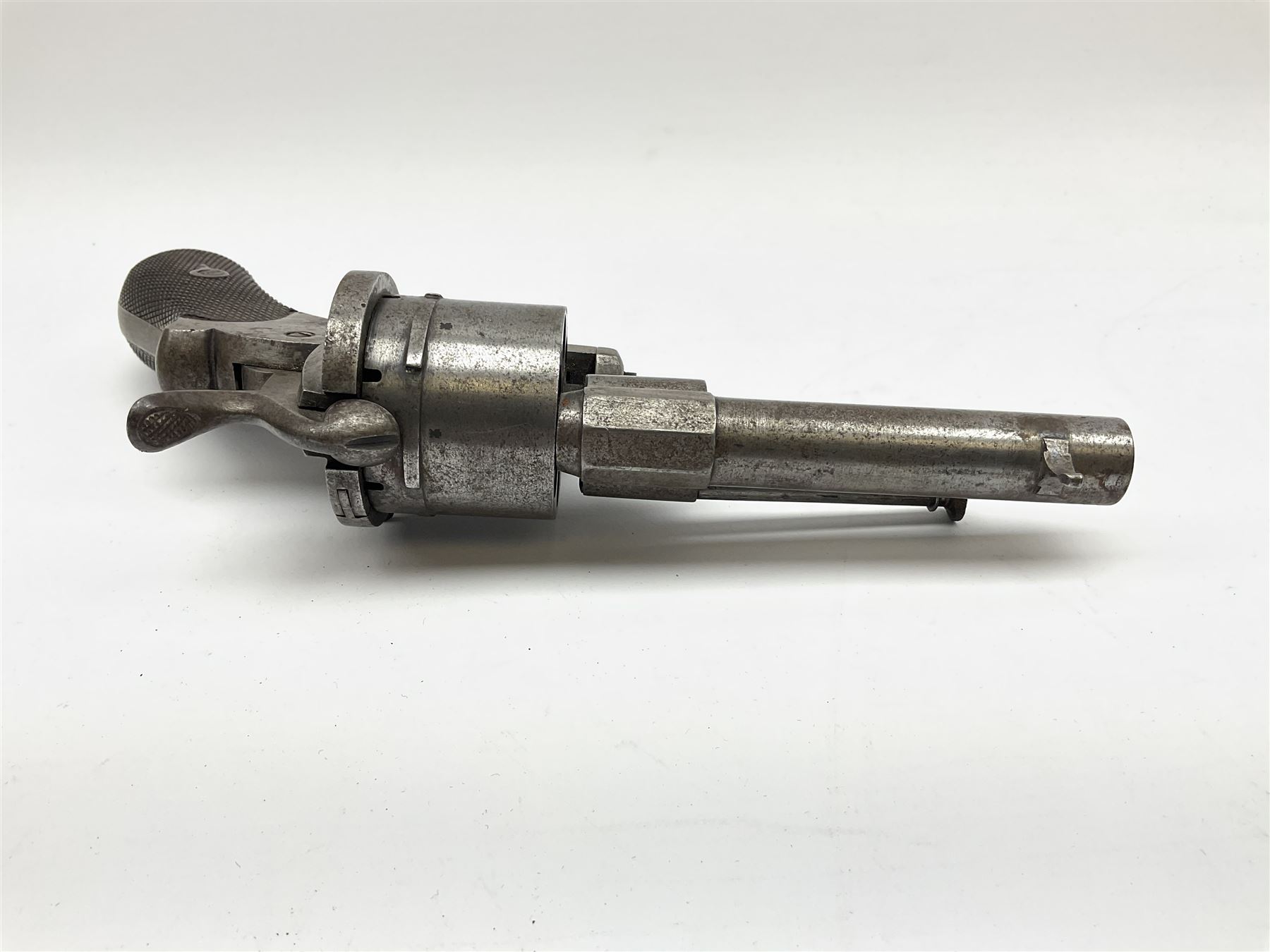 Mid-19th century 12mm (approx. .45cal.) six-shot pin fire revolver with single and double action, bears English proof marks, rifled barrel, fitted ejector rod and chequered walnut split grips L25cm