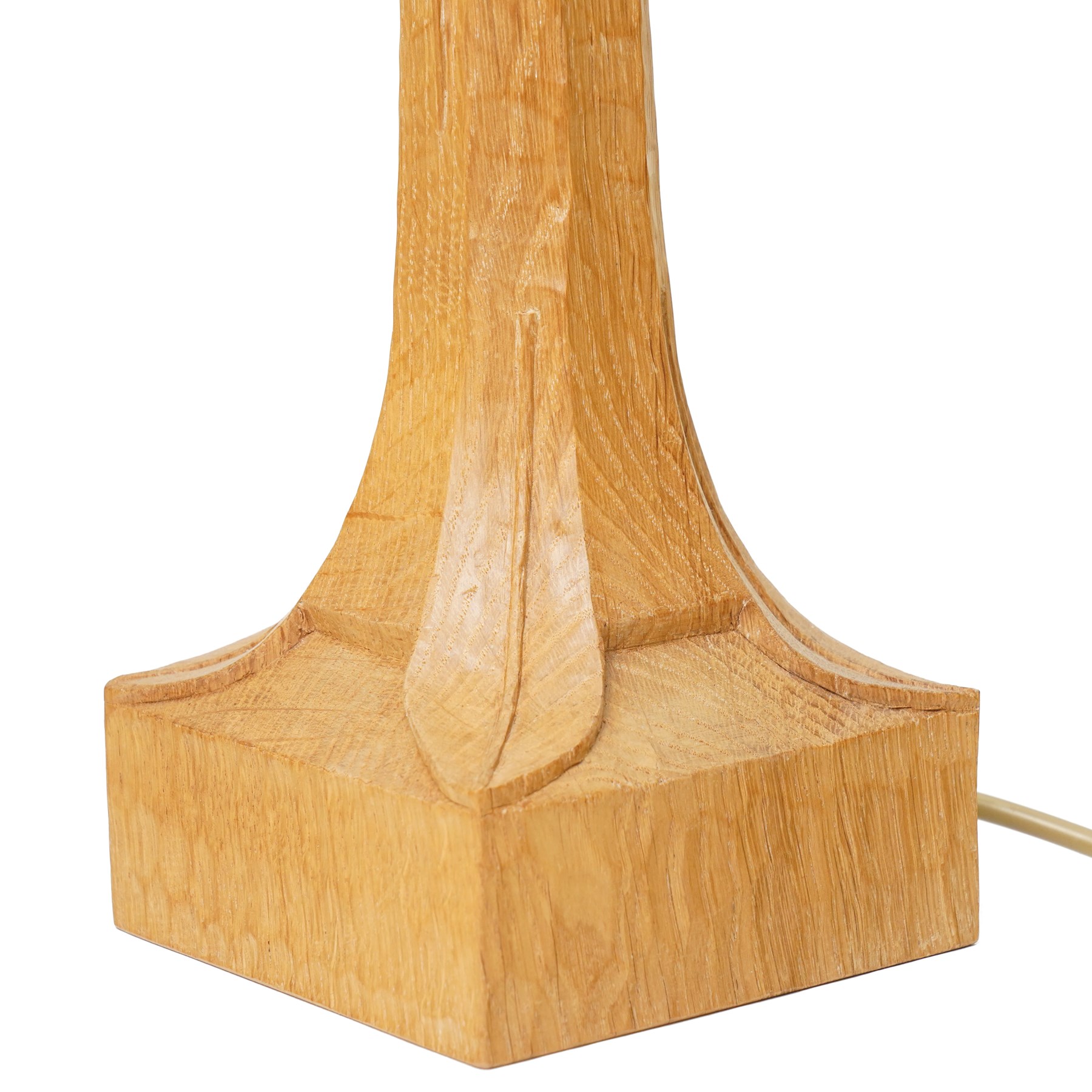 Mouseman - tooled oak table lamp, tapered octagonal stem terminating to square base carved with leaf motifs, with red shade, including shade H60cm, and with carved mouse signature, by the workshop of Robert Thompson of Kilburn