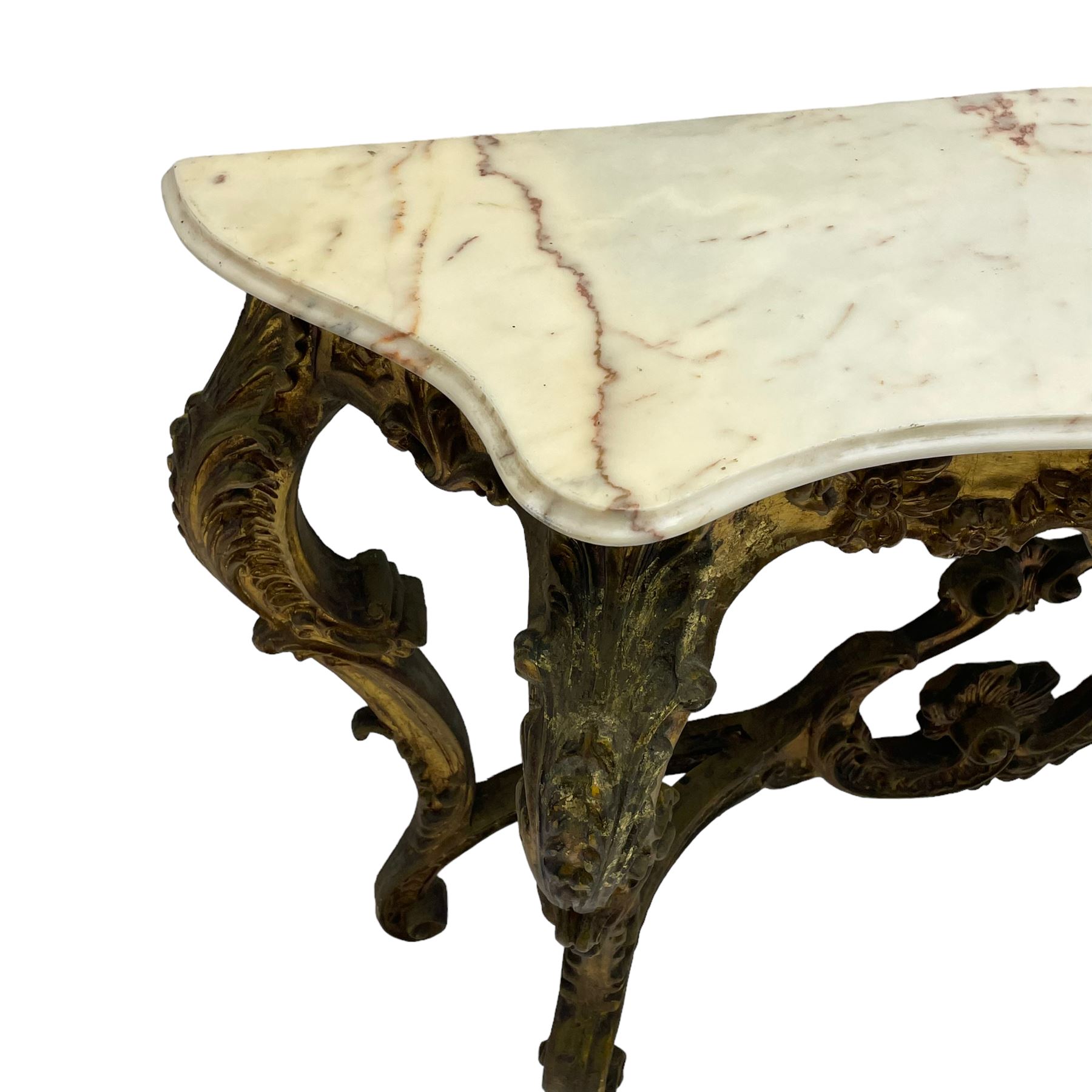 French Rococo design console or pier table, shaped and moulded pale marble top, the apron carved with pierced shell and scrolling acanthus leaves, extending flower head decoration, on four acanthus carved cabriole supports with scrolled terminals, united by shell moulded stretcher rails with central scrolled foliage cartouche 