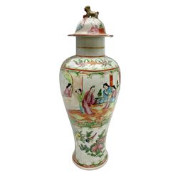 19th century Cantonese Famille Rose vase of slender baluster form, decorated with typical panels of birds and flowers alternating with figures, the cover with gilt dog of Fo finial,  with blue four character mark beneath, H33cm