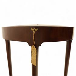 20th-century Georgian Revival style double fold-over card table, the first hinged circular top with polished mahogany surface above a second hinged circular top revealing a green baize playing surface with four counter-wells, underneath with a recessed compartment with and  chip and dice wells, the apron with fitted lock and key, raised on slender straight legs with pad feet 