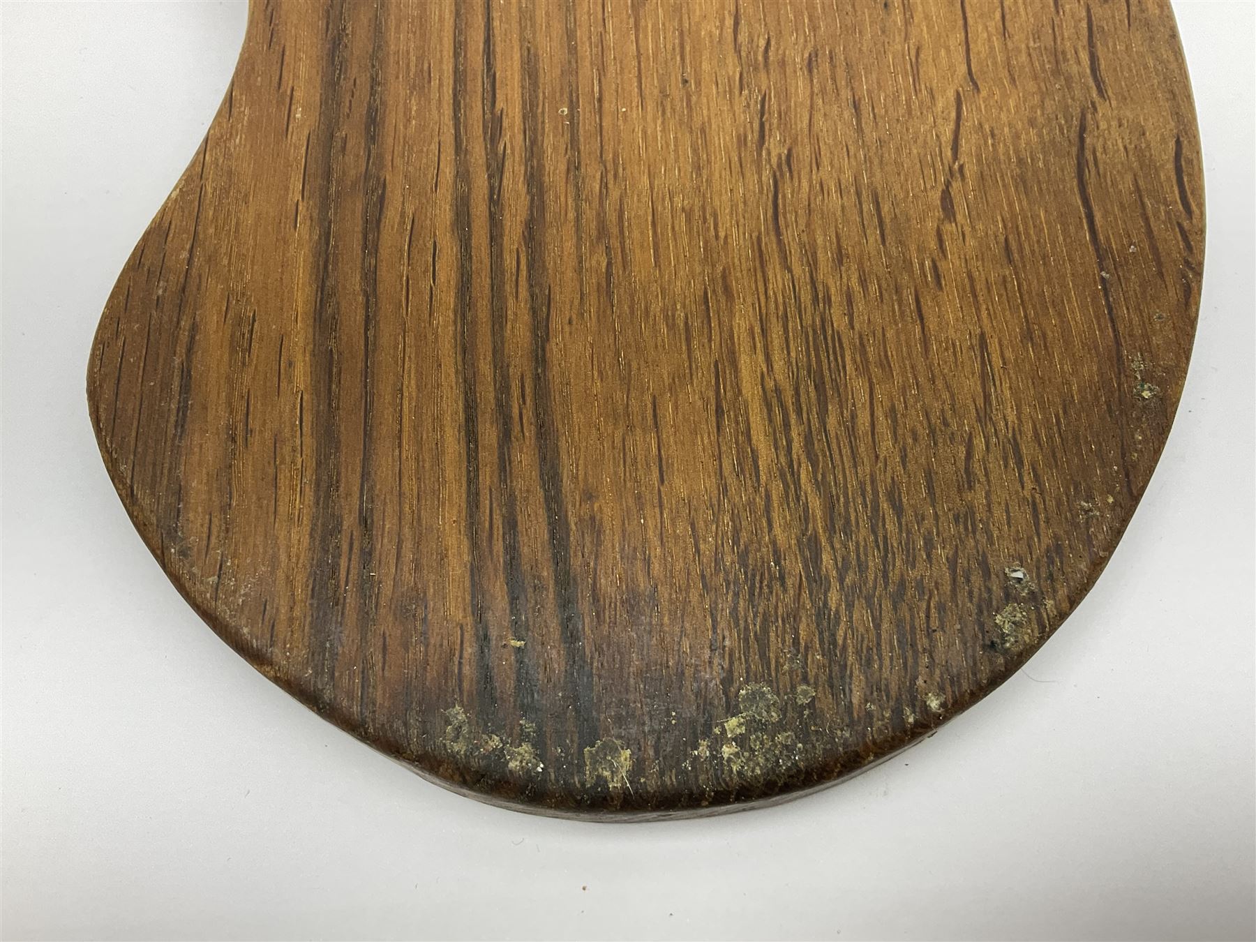 Mouseman - oak kidney-shaped cheeseboard, the handle caved with mouse signature, by the workshop of Robert Thompson, Kilburn 