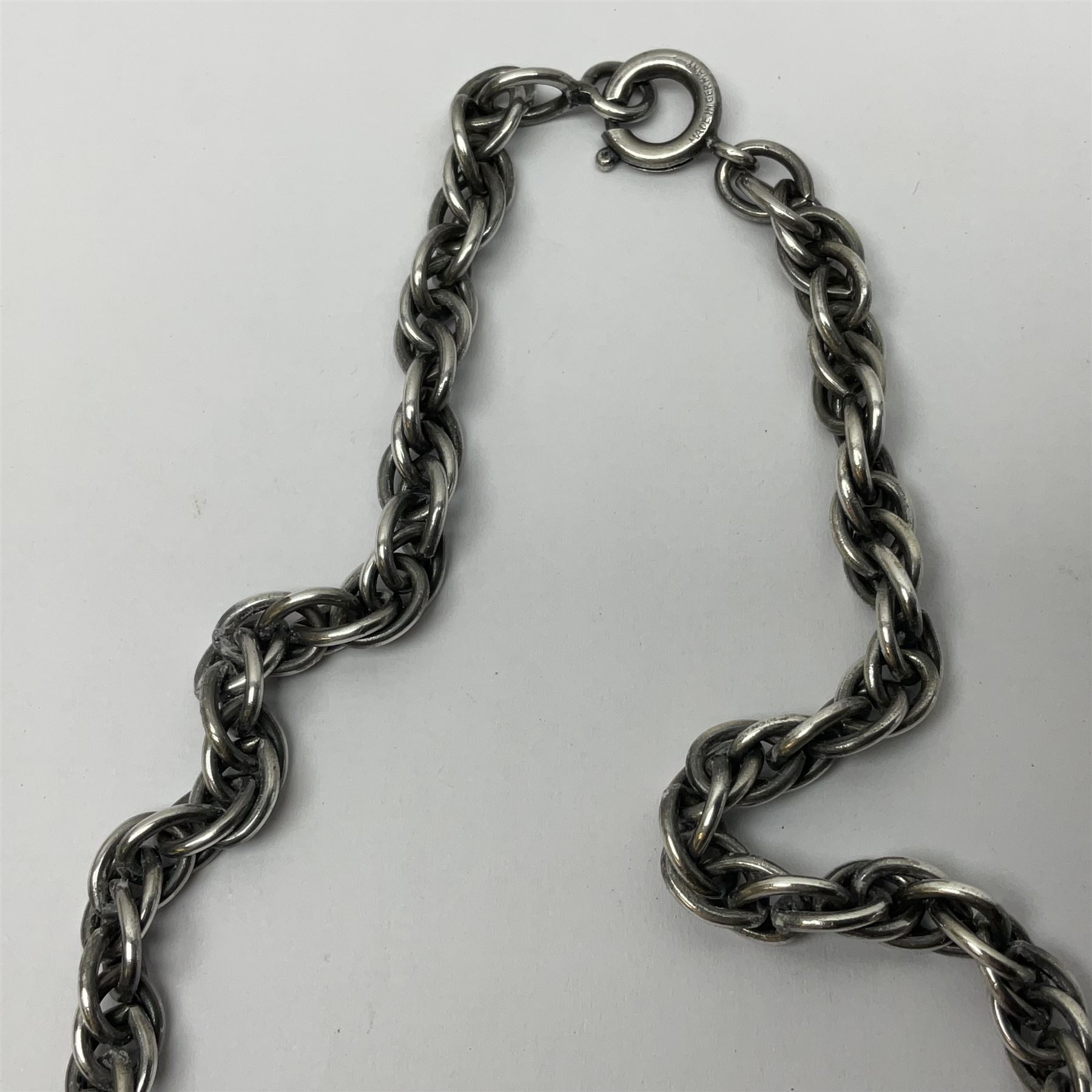 Joseff of Hollywood, circa 1950s metal and white paste necklace, with three graduated pendant drops set with white paste, to a Prince of Wales chain, signed with round script tag