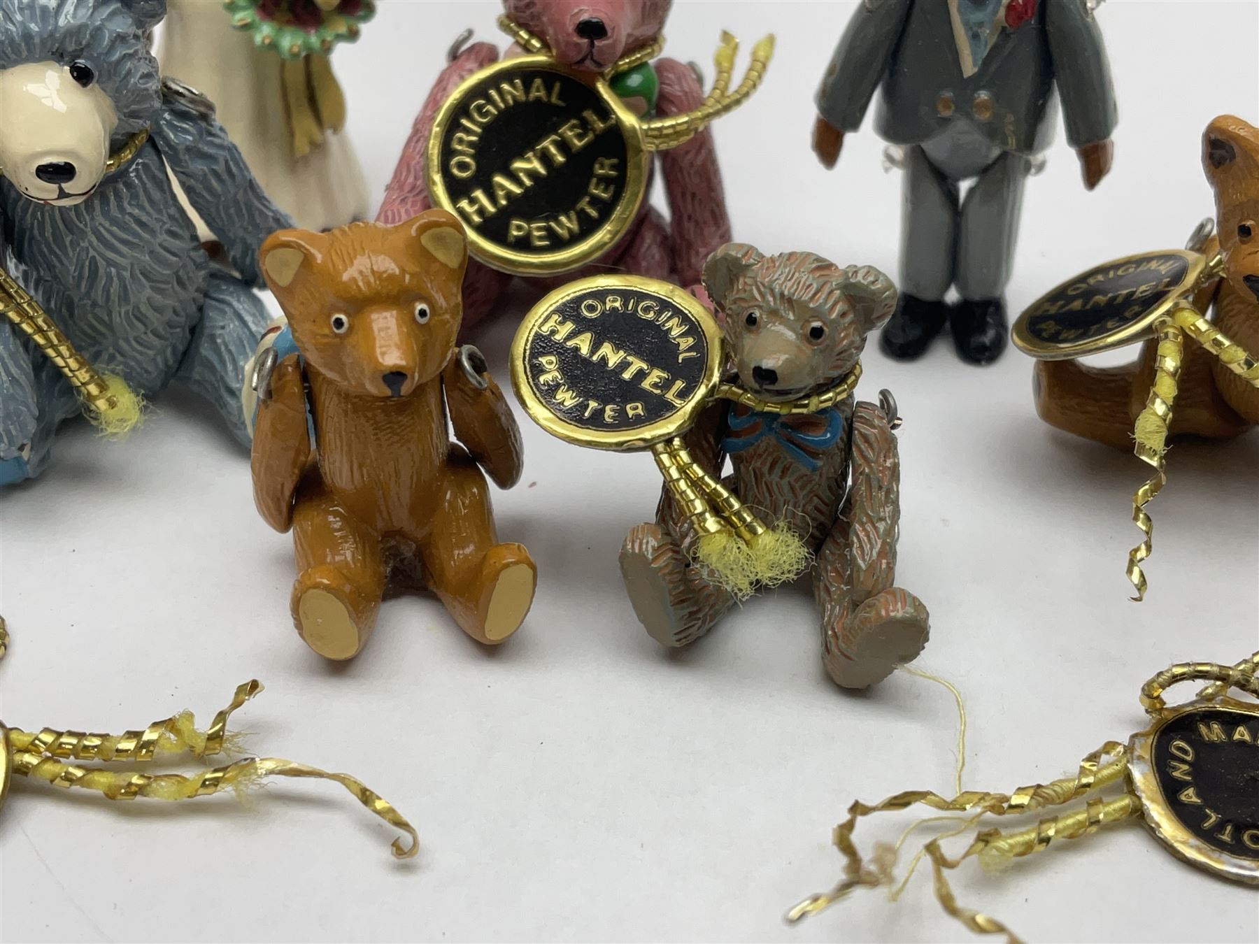 Seven Hantel miniature articulated pewter teddy bears, including bride and groom 