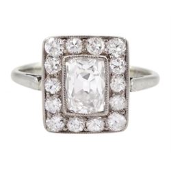 Art Deco platinum and white gold milgrain set diamond ring, circa 1920's, the central cushion cut diamond of approx 0.90 carat, with old cut diamond surround, total diamond weight approx 1.10 carat