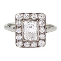 Art Deco platinum and white gold milgrain set diamond ring, circa 1920's, the central cushion cut diamond of approx 0.90 carat, with old cut diamond surround, total diamond weight approx 1.10 carat