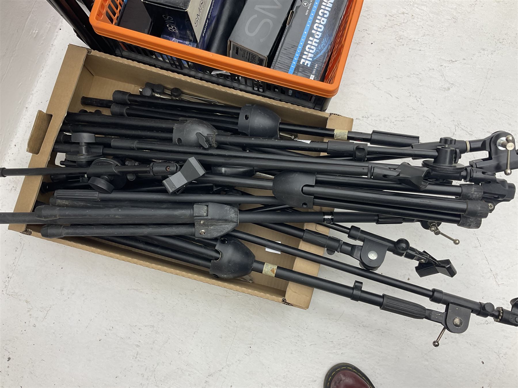 Two Shure SM58 microphones, Gatt Audio DM-700 microphone, other boxed and unboxed microphones and various microphone and music stands