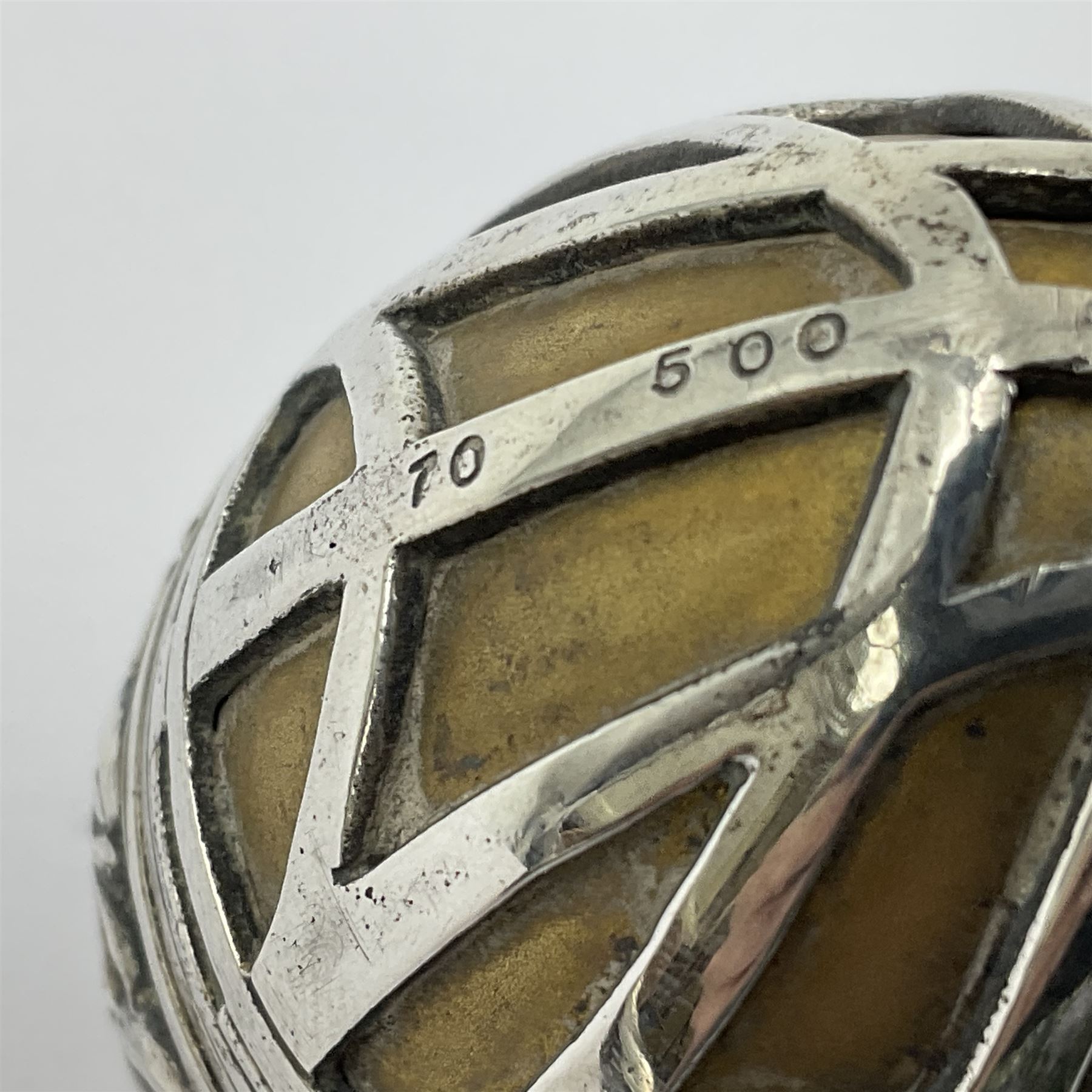 Modern silver limited edition Easter egg, no. 70/500, the gilded body decorated in relief with silver latticework and a band of flower heads, the detachable cover opening to reveal a gilt interior, each hallmarked St James House Company, London 1978, H5.5cm