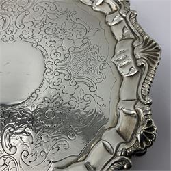 George III silver waiter, of hexagonal form, with shaped oblique gadrooned rim, embossed with anthemion to each corner, engraved with C scroll, floral and foliate decoration to centre, upon three trefid feet, hallmarked Richard Rugg I, London 1761, D18.8cm