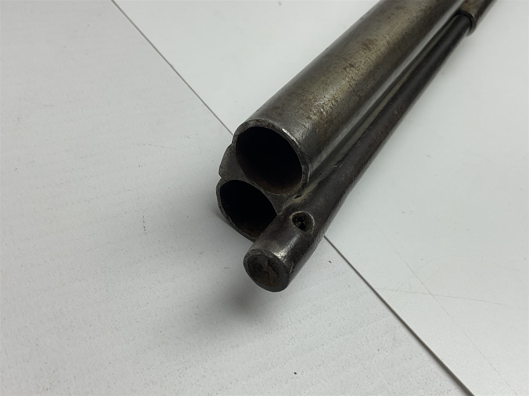 19th century Indian .577 Enfield muzzle loading rifle, proofed for 26-bore, the 98.5cm barrel with three barrel bands and later ram rod L140cm overall; 19th century Belgian side-by-side double barrel percussion shotgun, approximately 20-bore, with 74cm barrels and studded walnut stock, lock plate marked 'Liege 1868' and 'V. Gulikers-Maquinay' L117cm overall; and another side-by-side double barrel shotgun by Smythe with underlever opening (3)