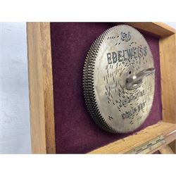 Victorian rectangular disc music box, the hinged lid with printed decoration of a young girl lifting to reveal a brass plate with single comb movement, with six discs, housed in pine case
