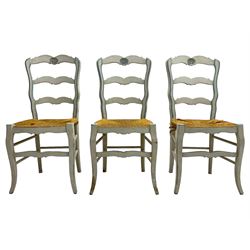 20th century set of six painted hardwood French design dining chairs, shaped ladder back, the cresting rail carved with shell motifs, rush seat on cabriole front supports united by turned stretchers, in distressed grey and blue paint finish 