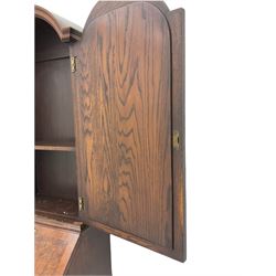 Small early 20th century Queen Anne style bookcase on bureau secretaire, the moulded arched pediment over mirrored door in shaped frame, the bureau fitted with fall front enclosing curved fitted interior, cushion moulded drawer over single drawer, on scroll and shell carved cabriole supports