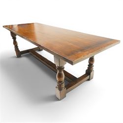 17th century design 8ft dark oak refectory dining table, the rectangular top raised on four turned baluster supports united by H-stretcher