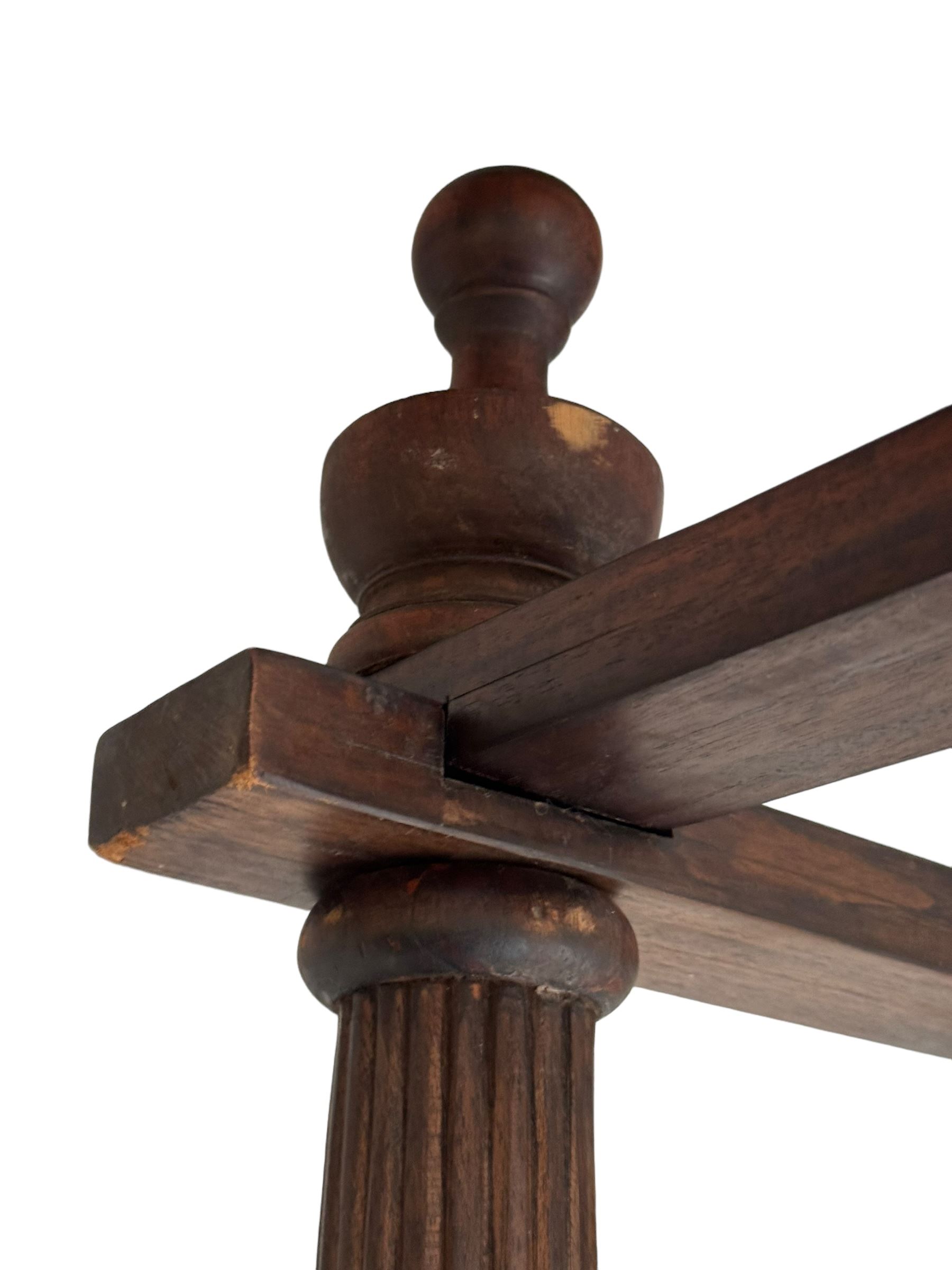 Georgian design Indian sheesham hardwood framed four poster bed, lattice slats to the top supported by reeded cylindrical and octagonal column uprights, the pierced stepped headboard carved with floral motifs, with associated mattress