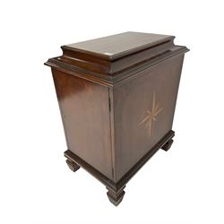Regency style mahogany pedestal cabinet, sarcophagus top over single door enclosing drawer, the sides inlaid with star motifs, on square tapering lobe carved feet