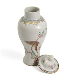 Chinese Export famille rose baluster form vase and cover, decorated with a bird perched on a flowering branch beside rocks, Qianlong style, probably later, H22.5cm