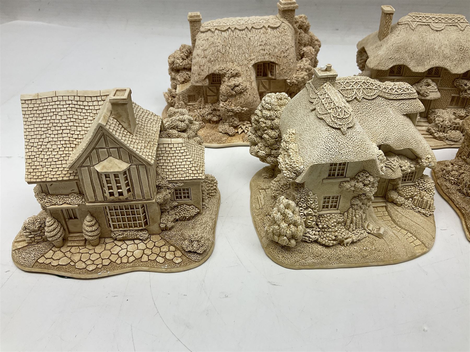 Twenty-three Lilliput Lane models from the Paint Your Own collection, to include Catmint Cottage, Sugar and Spice, Gypsy Cottage, Ruby Cottage and Little Birch, some boxed