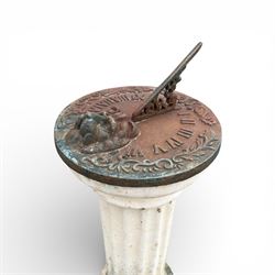 Cast stone garden sundial featuring a cast iron top with Roman numerals and lions head motif