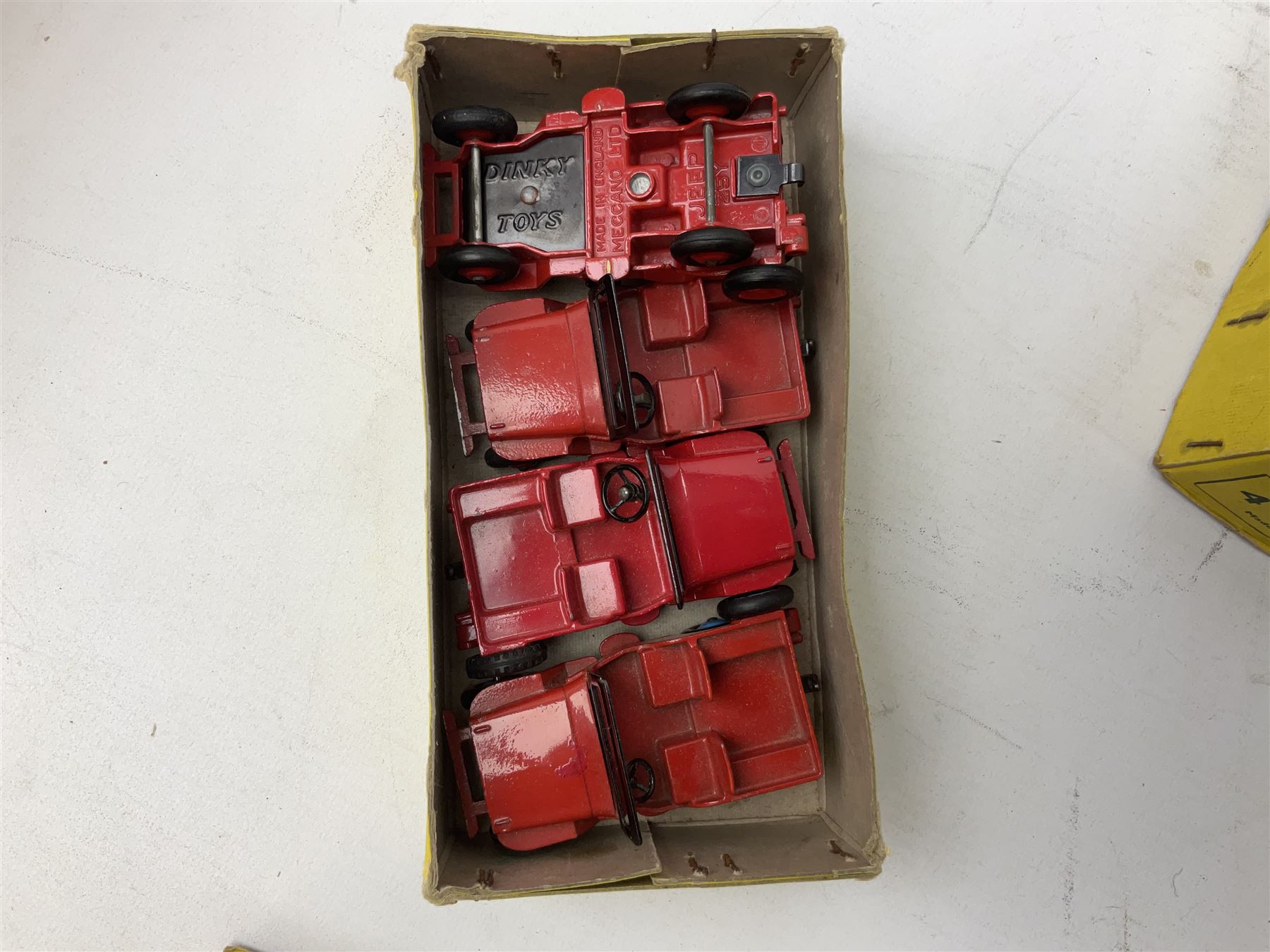 Dinky - trade shop stock box containing four Universal Jeeps No.25Y; and two others containing four Land-Rover Trailers No.27M and three (ex.4) Land-Rovers No.27D (3)