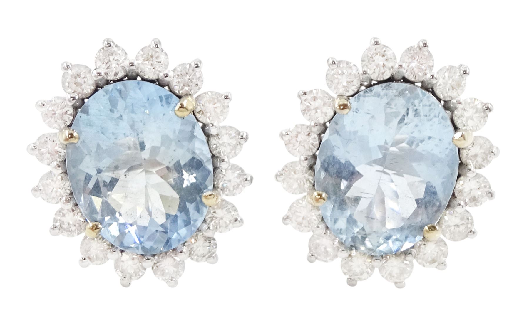 Pair of 18ct white gold oval cut aquamarine and round brilliant cut diamond cluster stud earrings, total aquamarine weight 5.00 carat, total diamond weight approx 1.05 carat