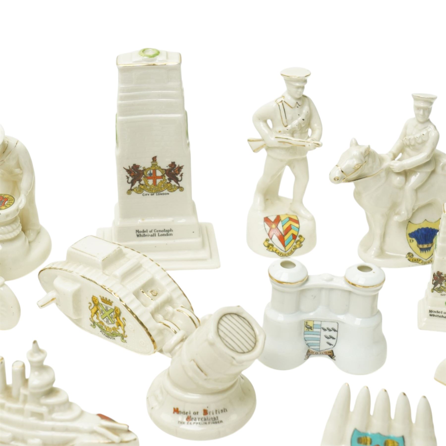 WWI crested china including Arcadian model of British Cavalry Soldier, another 'Tommy in Bayonet Attack', Swan China 'Despatch Rider', Arcadian 'Tommy Atkins', ambulance, E Boat, two tanks, Cenotaph etc