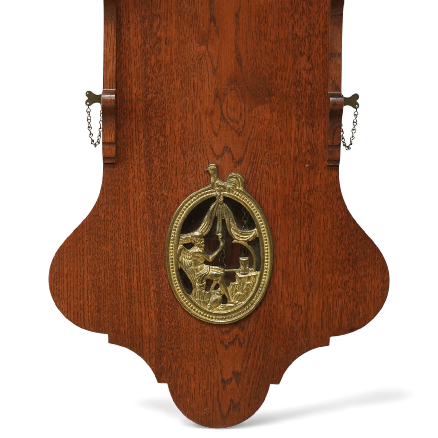 Dutch-mid 20th century Warmink WUBA wall clock, with a full length backboard and break arch hood with ebonised pilasters and three cast figures representing two trumpeting angels and Atlas to the pediment, with a fully painted break arch dial with a working axe moon dial and calendar aperture, chapter with Dutch minute arcading, Roman numerals and five minute Arabic's, three train chain driven countwheel striking movement with alarm and hours sounding on a bell. With three brass weights, brass chains and pendulum.