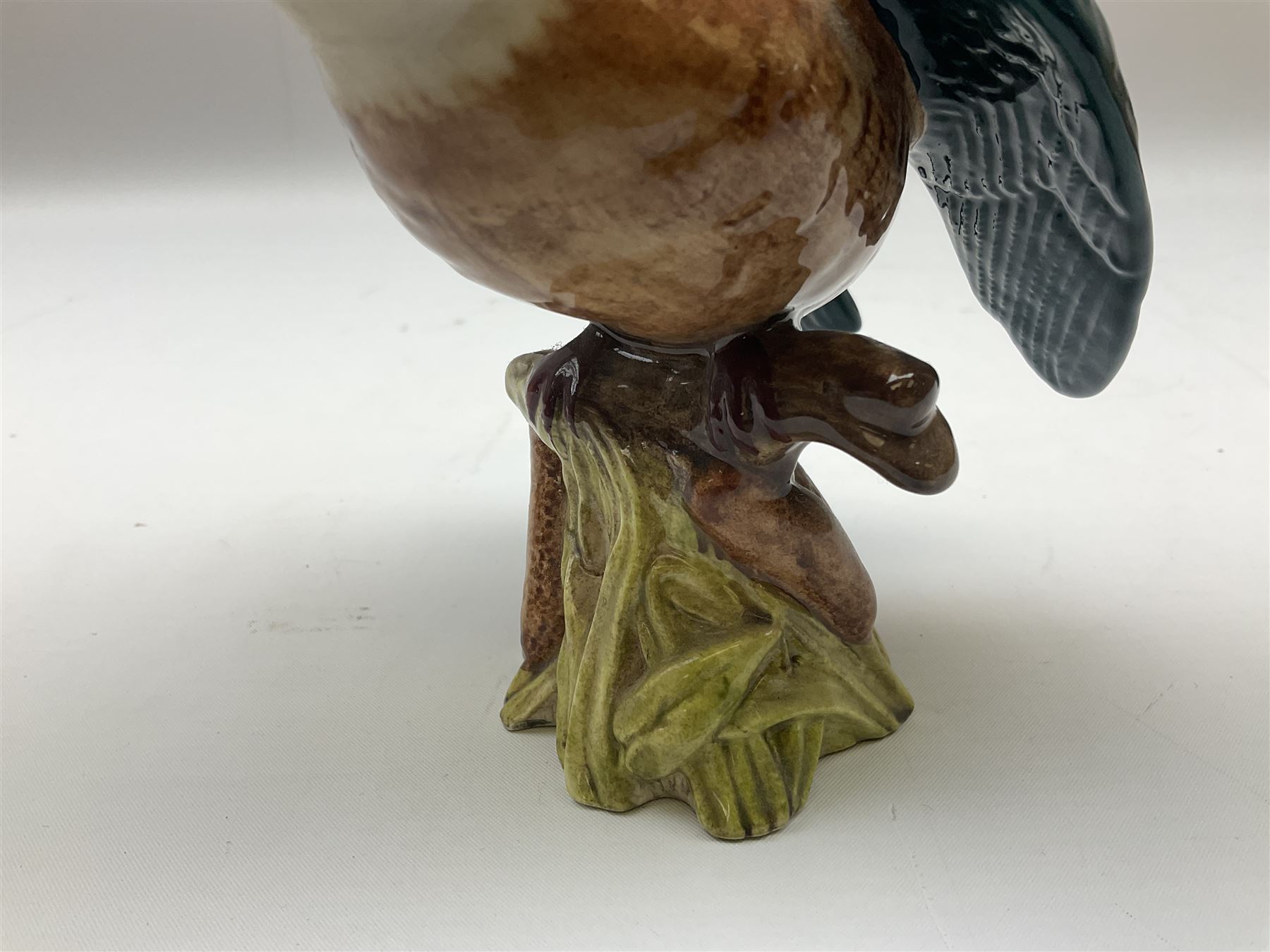 Karl Ens figure of a green woodpecker, modelled perched upon branch, model no. 7527, together with Karl Ens figure of budgie and Beswick Kingfisher no. 2371, all with printed marks beneath, tallest H25cm