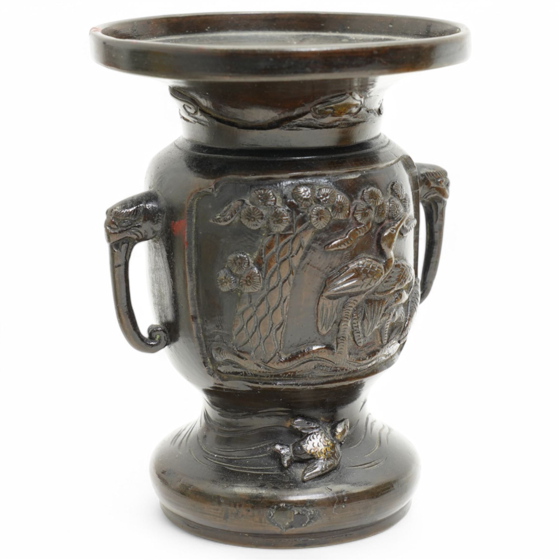 Chinese 20th century polished bronze rice pot with swing handle and raised pattern of dragons D18cm, Meiji period Japanese bronze two handled vase H13cm and a Chinese porcelain bowl from the Tek Sing cargo D15cm (3)