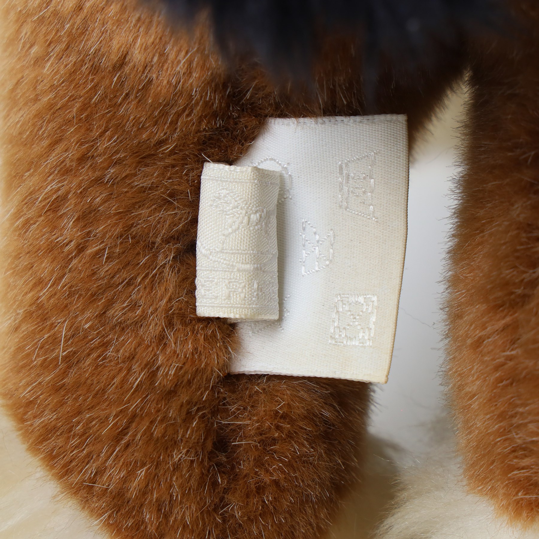 Hermès - ‘Cheval Hermy’ plush horse, brown with black mane and tail, white faux-fur hooves and orange ribbon detailing