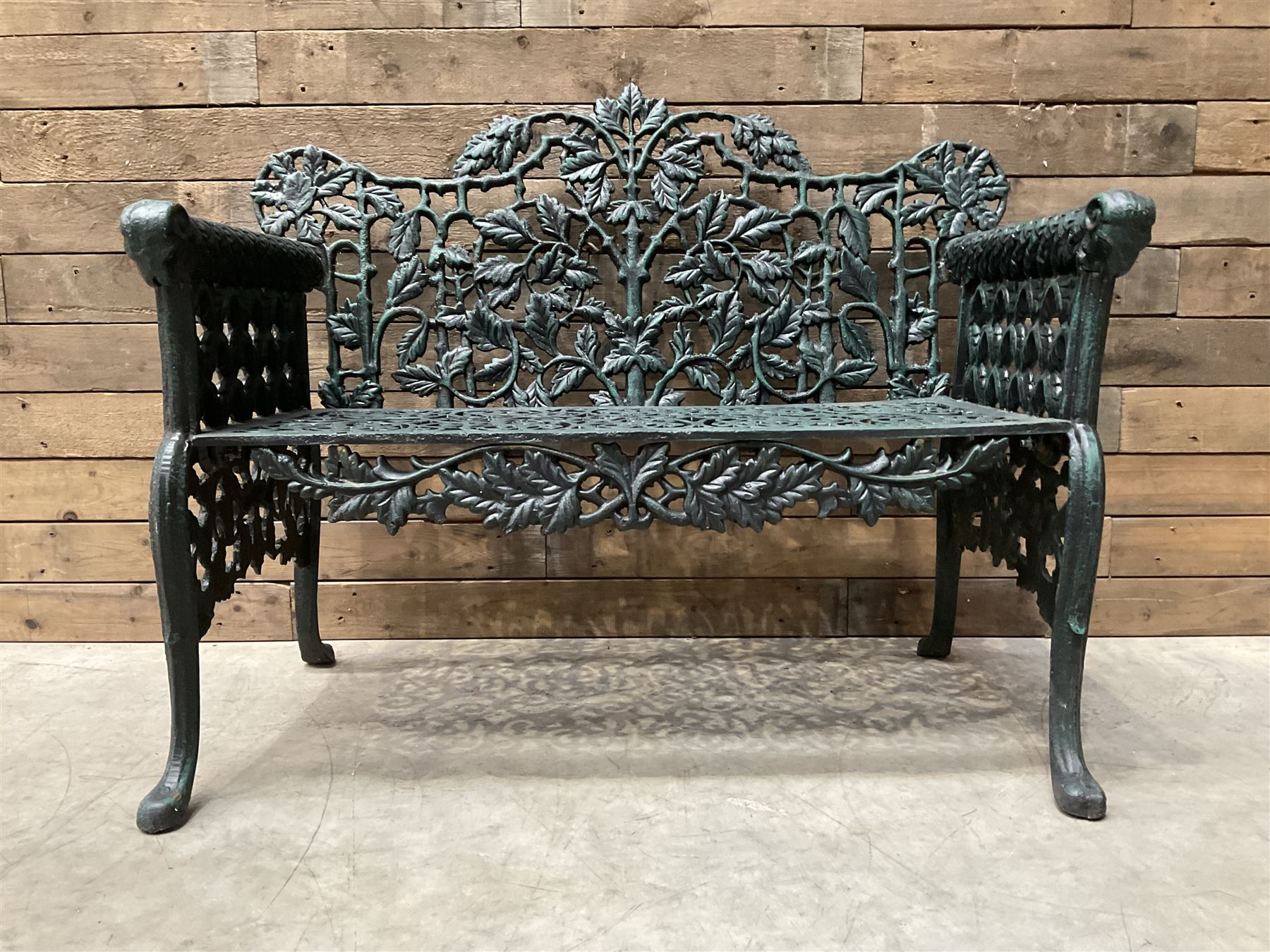 Victorian design heavy cast iron garden bench, ornate shaped back with rope twist and ramshead arms H88cm, W100cm
