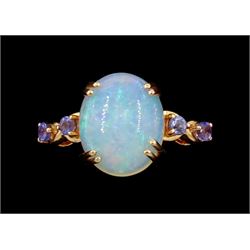 9ct rose gold single stone opal ring, with tanzanite set shoulders, hallmarked