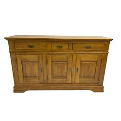 Oak sideboard, fitted with three drawers and three cupboards, enclosed by panelled doors, on bracket feet