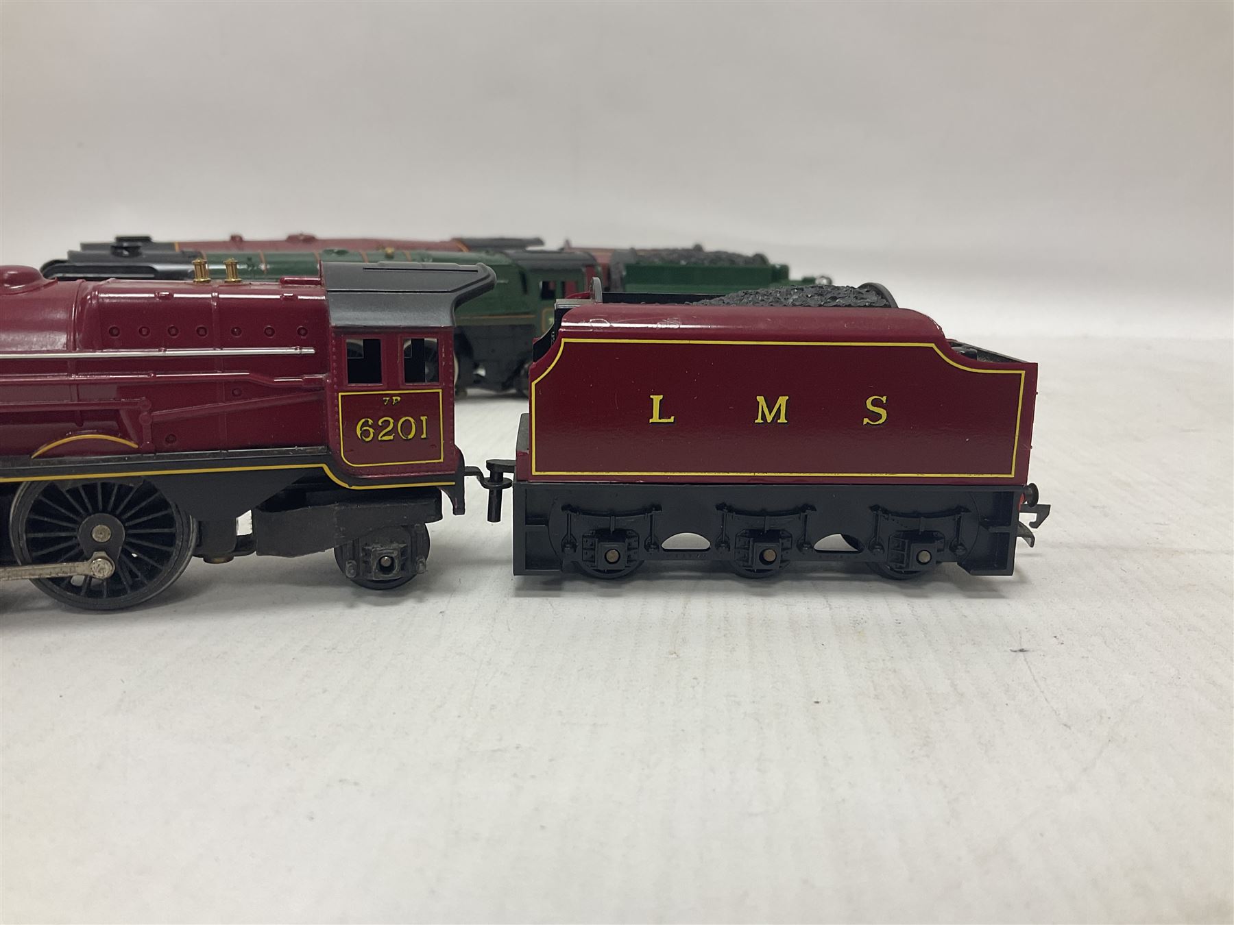 Hornby ‘00’ gauge - four steam locomotives comprising Britannia Class ‘Britannia’ 4-6-2 no.70000 in BR green; Britannia Class ‘Oliver Cromwell’ 4-6-2 no.70013 in BR green; Princess Class 4-6-2 no.6201 in LMS crimson; Coronation Class ‘Duchess of Sutherland’ 4-6-2 no.6233 in LMS crimson; one further tender (5) 