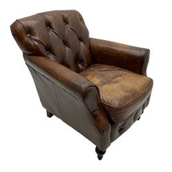 Georgian design club armchair, upholstered in buttoned brown leather, on turned front feet