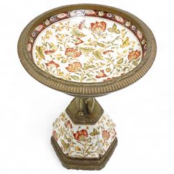 Wong Lee comport, with polychromatic enamel floral decoration, the stem formed as kneeling cherub, marked to base, H37cm 