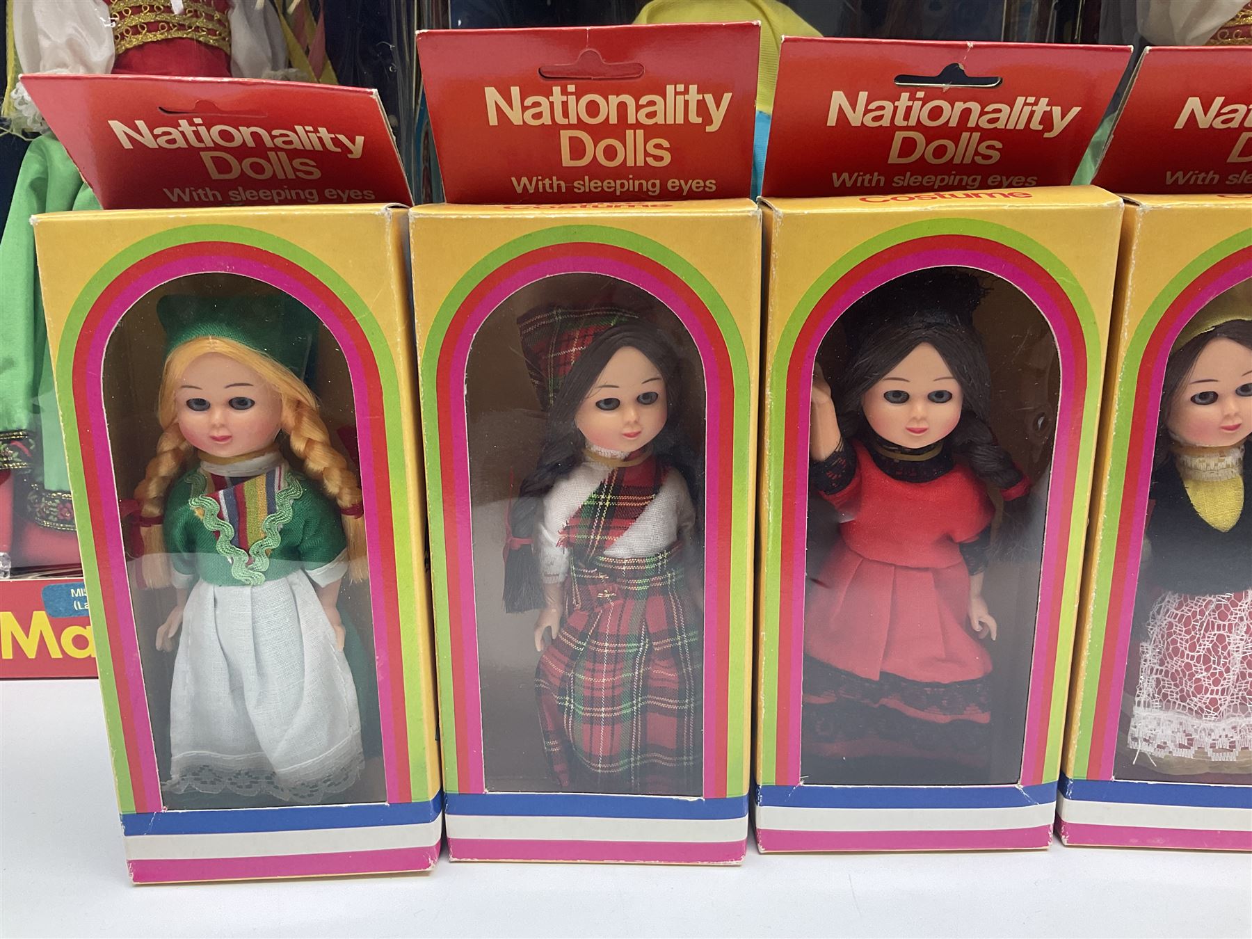 Four Mayfair Products Musical Dolls of Many Lands; original boxes and delivery boxes; and set of twelve Nationality Dolls with Sleeping Eyes; boxed (16)
