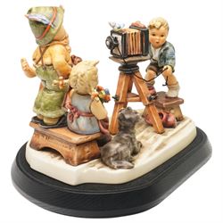 Goebel M I Hummel Club limited edition 25th Anniversary Group figurine 'Picture Perfect', numbered 552/2500, modelled as four children taking a photograph, with stand and plaque, printed marks to base, excluding plinth W27cm 